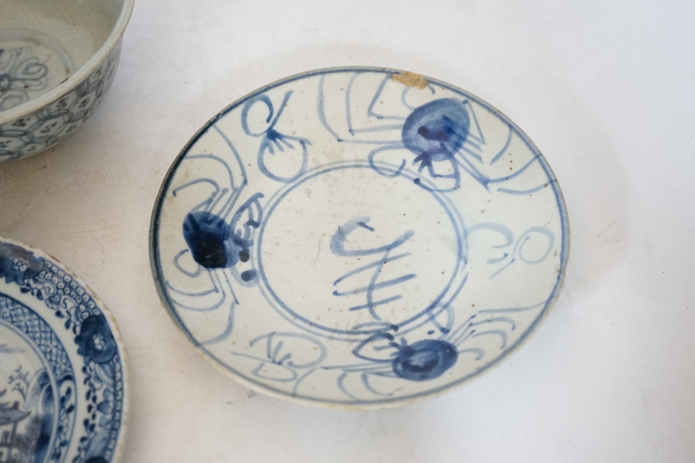 A Chinese Ming blue and white bowl and two Qing dynasty dishes, largest 17cm diameter